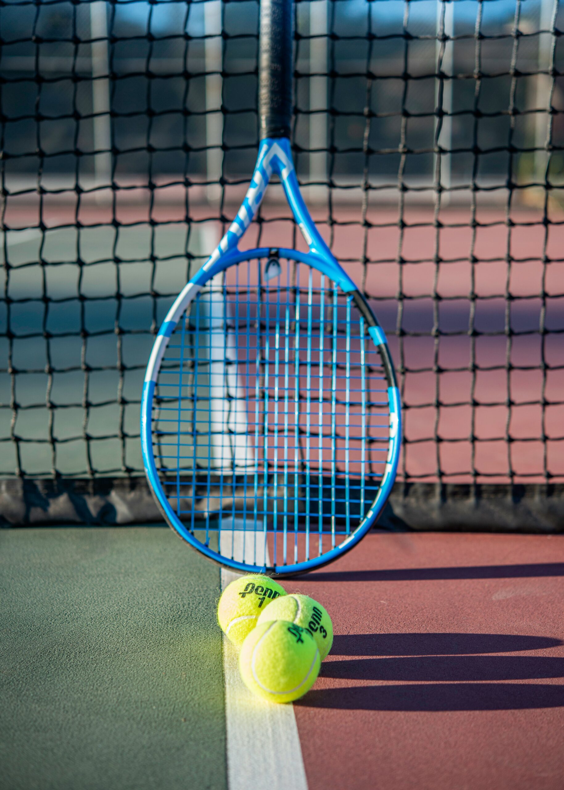 Young Tennis Players Competing against Older Kids